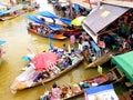 SAMUT SONGKHRAM, THAILAND Ã¢â¬â JUNE 10, 2018 : Wooden boats busy ferrying people at Amphawa floating market on June 10, 2018.